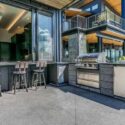 An outdoor kitchen on a sunny day outside a home