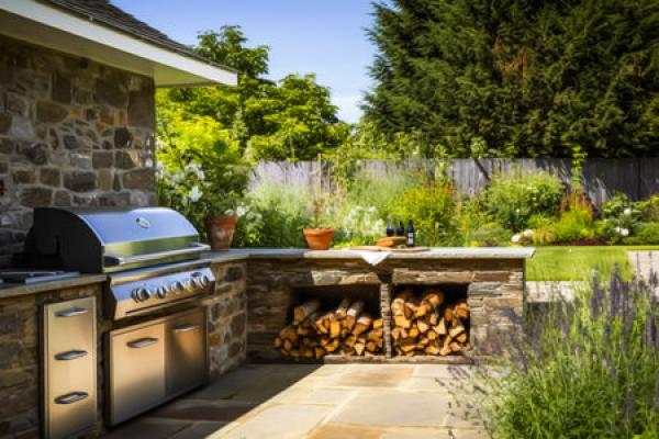 An outdoor kitchen with a long countertop