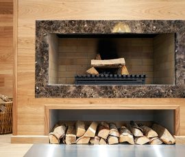 granite and wood fireplace surround