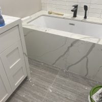 A marble bathtub surround from MC Granite Countertops.